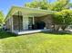 Back porch of brick house complete with furniture and grill at 2892 S State Road 267, Plainfield, IN 46168