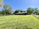 Wide backyard with lawn and tree-lined perimeter at 2892 S State Road 267, Plainfield, IN 46168