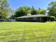 Spacious backyard with green lawn, enclosed by a chain-link fence at 2892 S State Road 267, Plainfield, IN 46168