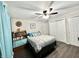 Comfortable bedroom featuring a ceiling fan, a queen bed, and warm wood-look flooring at 2892 S State Road 267, Plainfield, IN 46168
