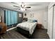 Comfortable bedroom featuring a ceiling fan, a queen bed, and warm wood-look flooring at 2892 S State Road 267, Plainfield, IN 46168