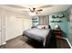 Bedroom features hardwood floors, a ceiling fan, and a large closet at 2892 S State Road 267, Plainfield, IN 46168