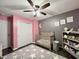 Sweet Bedroom featuring a crib, star-patterned rug, and ample closet space at 2892 S State Road 267, Plainfield, IN 46168