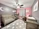 Sweet Bedroom featuring a crib, changing table, rocking chair, and star-patterned rug at 2892 S State Road 267, Plainfield, IN 46168
