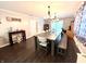 Dining room with hardwood floors, stylish lighting, and long table at 2892 S State Road 267, Plainfield, IN 46168
