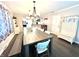 Open concept dining room area with hardwood floors and modern table at 2892 S State Road 267, Plainfield, IN 46168
