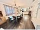 Open concept dining room area with hardwood floors and large table at 2892 S State Road 267, Plainfield, IN 46168