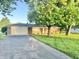 Brick home featuring attached garage and well-maintained front yard at 2892 S State Road 267, Plainfield, IN 46168