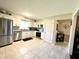 Bright kitchen features stainless steel appliances and tiled flooring at 2892 S State Road 267, Plainfield, IN 46168