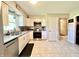 Bright kitchen features stainless steel appliances and granite countertops at 2892 S State Road 267, Plainfield, IN 46168