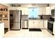 Modern kitchen with stainless steel appliances, granite countertops, and white cabinets at 2892 S State Road 267, Plainfield, IN 46168