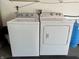 Laundry area features a white Whirlpool washer and dryer set at 2892 S State Road 267, Plainfield, IN 46168