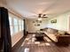 Cozy living room with hardwood floors, a large sectional sofa, and plenty of natural light at 2892 S State Road 267, Plainfield, IN 46168