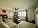 Relaxing living room with hardwood floors, a large sectional sofa, a coffee table, and a tv set up at 2892 S State Road 267, Plainfield, IN 46168