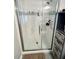 Modern bathroom shower features sleek glass doors and mosaic tile accent at 2892 S State Road 267, Plainfield, IN 46168