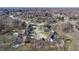 Aerial view of a residential neighborhood with houses and trees at 4738 Moss Creek Ct, Indianapolis, IN 46237
