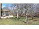 Landscaped backyard with mature trees at 4738 Moss Creek Ct, Indianapolis, IN 46237