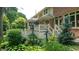House with deck, well-manicured landscaping, and water pump at 4738 Moss Creek Ct, Indianapolis, IN 46237