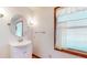 Clean bathroom with a white vanity and an oval mirror at 4738 Moss Creek Ct, Indianapolis, IN 46237