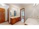 Bathroom boasts a double vanity and updated countertop at 4738 Moss Creek Ct, Indianapolis, IN 46237