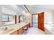 Large bathroom with double vanity and a jetted tub at 4738 Moss Creek Ct, Indianapolis, IN 46237