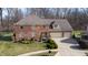 Brick two-story house with attached garage and landscaped yard at 4738 Moss Creek Ct, Indianapolis, IN 46237