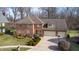Brick house with a two-car garage and landscaped yard at 4738 Moss Creek Ct, Indianapolis, IN 46237