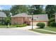 Two-story brick home with a two-car garage and manicured lawn at 4738 Moss Creek Ct, Indianapolis, IN 46237