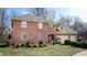 Two-story brick home with a three-car garage and manicured lawn at 4738 Moss Creek Ct, Indianapolis, IN 46237
