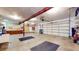 Spacious two-car garage with extra storage shelving and flooring at 4738 Moss Creek Ct, Indianapolis, IN 46237