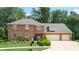 Two-story brick home with attached two-car garage at 4738 Moss Creek Ct, Indianapolis, IN 46237