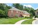 Two-story brick home with attached two-car garage at 4738 Moss Creek Ct, Indianapolis, IN 46237