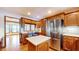 Kitchen boasts stainless steel appliances and oak cabinetry at 4738 Moss Creek Ct, Indianapolis, IN 46237