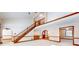 Living room with hardwood floors and staircase at 4738 Moss Creek Ct, Indianapolis, IN 46237
