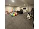 Spacious finished basement featuring plush carpeting, recessed lighting, and ample space for recreation and relaxation at 8722 Rockwood Ln, Indianapolis, IN 46259