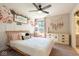 Inviting bedroom with floral wallpaper, soft lighting, and a cozy reading nook by the window at 8722 Rockwood Ln, Indianapolis, IN 46259