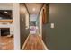 Hallway with view to playroom, fireplace and media, offering connectivity and style at 8722 Rockwood Ln, Indianapolis, IN 46259