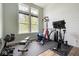 Dedicated home gym equipped with exercise equipment and natural light, promoting a healthy lifestyle at 8722 Rockwood Ln, Indianapolis, IN 46259