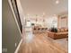 Open-concept kitchen with a white island and bar stool seating, seamlessly flowing into the living space at 8722 Rockwood Ln, Indianapolis, IN 46259
