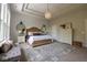 Spacious main bedroom featuring a decorative rug, dresser and bench with an abundance of natural light at 8722 Rockwood Ln, Indianapolis, IN 46259