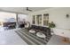 Stylish covered patio with comfortable seating, modern decor, and an inviting outdoor ambiance for relaxation at 8722 Rockwood Ln, Indianapolis, IN 46259