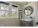 Charming powder room with shiplap walls, stylish mirror, and modern fixtures at 8722 Rockwood Ln, Indianapolis, IN 46259