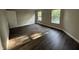 Comfortable bedroom featuring hardwood floors, two bright windows, and neutral walls at 17902 Cristin Way, Westfield, IN 46062
