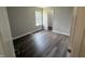 Comfortable bedroom featuring neutral walls, wood-look floors, and a bright window at 17902 Cristin Way, Westfield, IN 46062