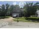 Charming two-story home with mature trees, well-manicured lawn, and attached two-car garage at 17902 Cristin Way, Westfield, IN 46062
