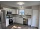 White kitchen with stainless appliances at 17902 Cristin Way, Westfield, IN 46062