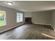 Spacious living room with hardwood floors and brick fireplace at 17902 Cristin Way, Westfield, IN 46062