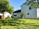 Spacious backyard of home featuring green grass and light grey siding at 1327 Blue Ridge Ln, Brownsburg, IN 46112
