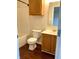 Full bathroom with tub-shower, wood cabinet vanity, and wood-look flooring at 1327 Blue Ridge Ln, Brownsburg, IN 46112