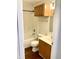 Bathroom showcasing wood cabinets and a combination tub and shower at 1327 Blue Ridge Ln, Brownsburg, IN 46112